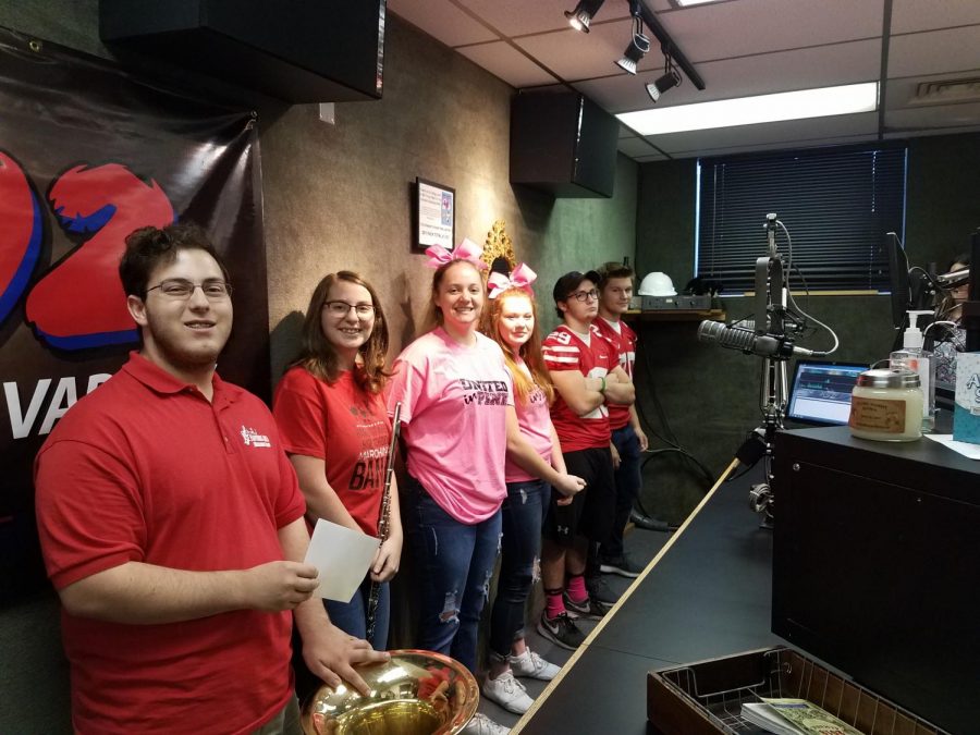 From left to right: Harley Ludy, Emma Riegel, Alexandra Kline, Mia James, Brandon Hamilton, and Benjamin Weidenhammer pose for a photo at the Y102 pep rally.