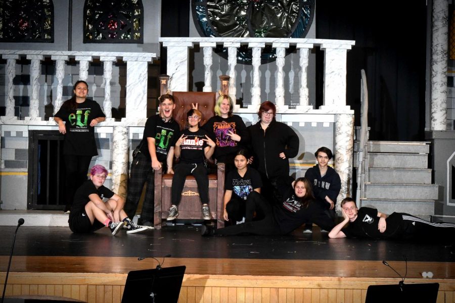 Stage crew looking behind the curtain